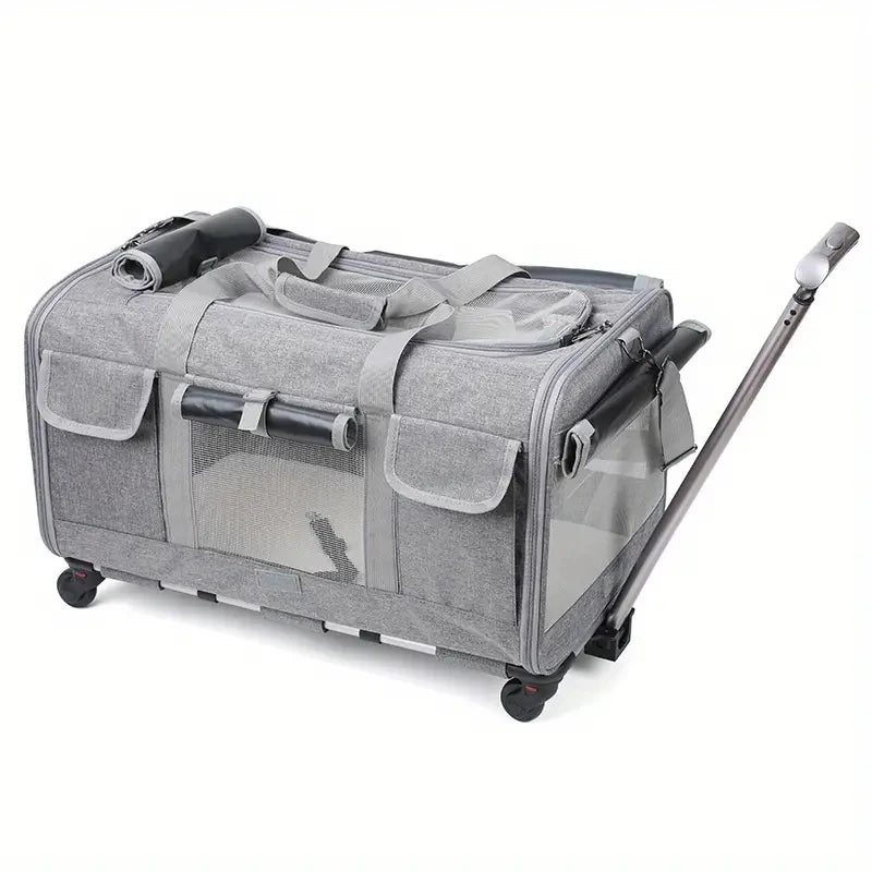 Gray pet travel crate with wheels and a handle on a white background
