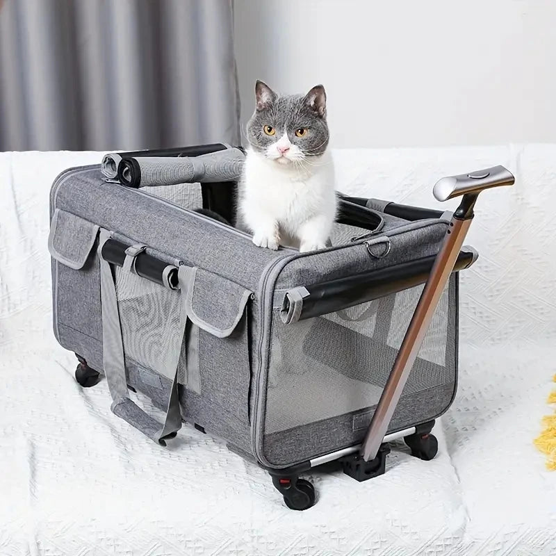 Cat sitting inside a gray pet stroller on a white blanket.