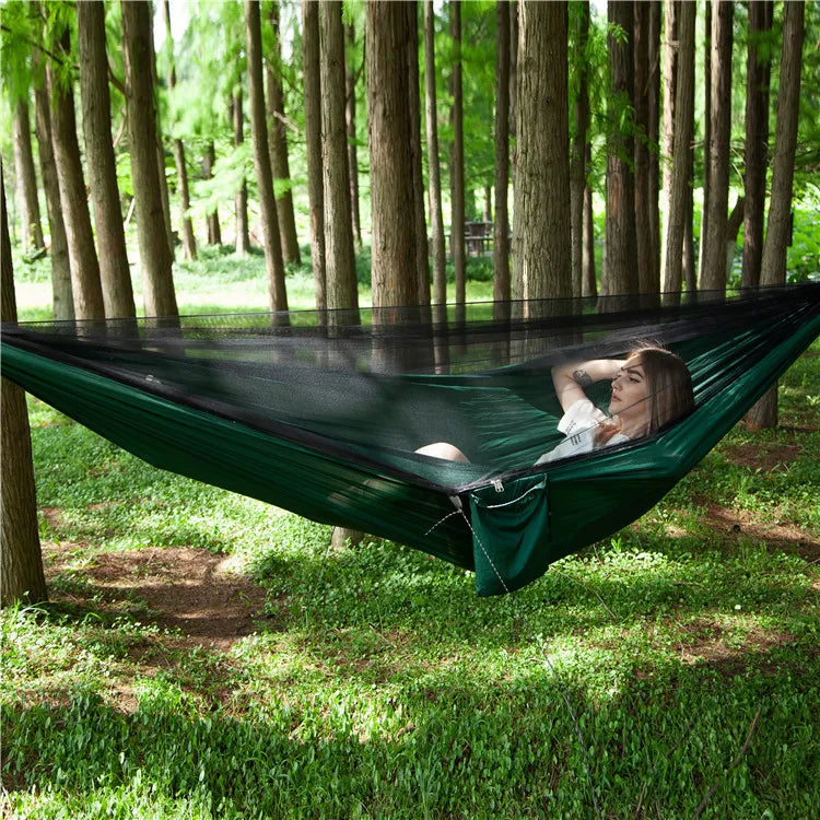 Two-person portable hammock with mosquito net, made from durable 210T nylon. Features strong nylon straps, adjustable loops, and a breathable bug-proof net for ultimate comfort and protection.